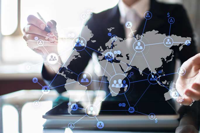 A professional showcasing a global network representing IT outsourcing, highlighting the extensive connections and benefits of IT outsourcing services worldwide.